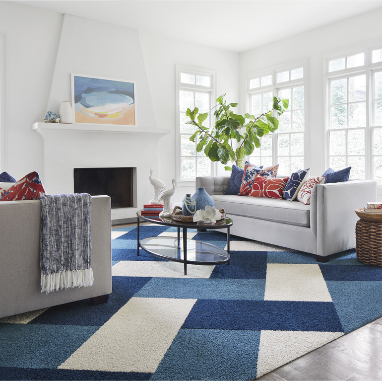 FLOR In The Deep living room area rug shown in Bone, Cobalt, and Tidal